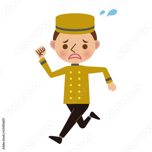 焦った表情で走るホテルフロントのベルボーイ