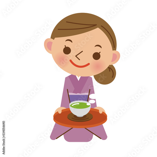 お客様にお茶を出す旅館の女将さん