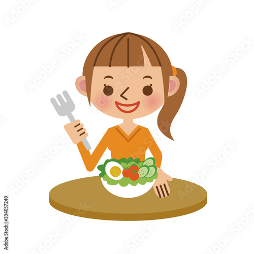 サラダを食べる女性