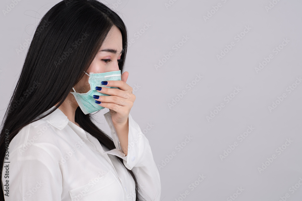 Close up woman wearing a hygiene protective mask to protect virus and pollution on white background. Health care and covid-19 corona virus sickness concept. Close up woman wearing a hygiene protective mask to protect virus and pollution on white background. Health care and covid-19 corona virus sickness concept.