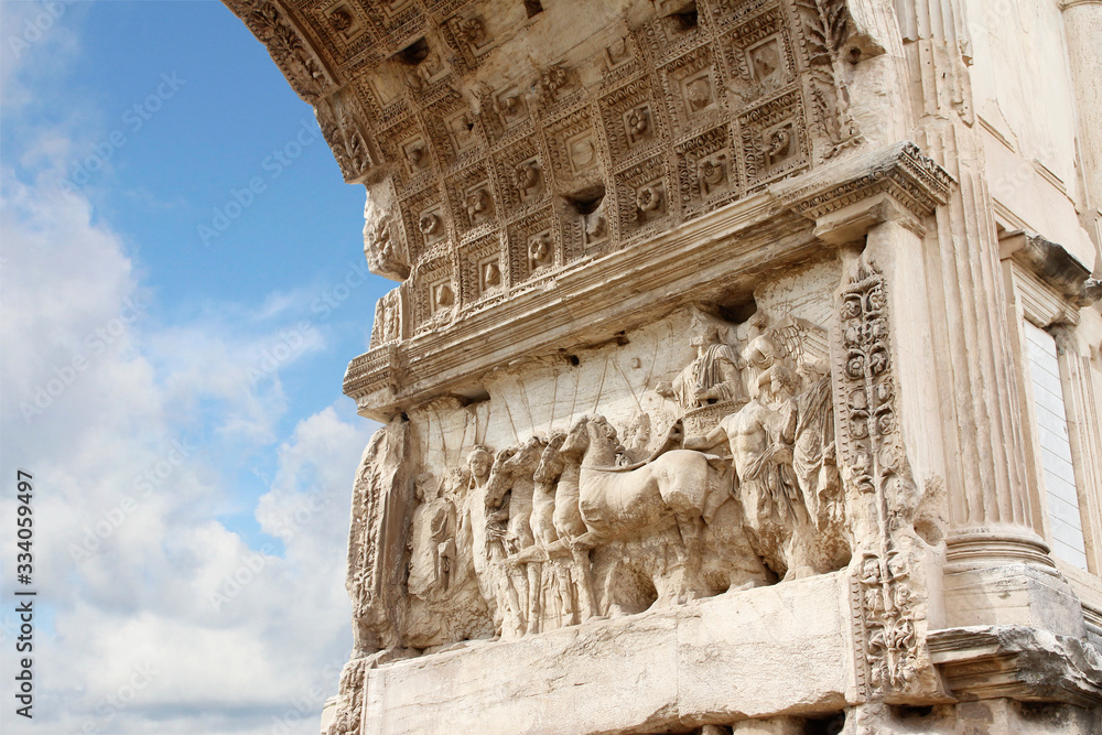 Detail of relief panel with the sunlight at Arch of Constantine during sunset in Rome, Italy Detail of relief panel with the sunlight at Arch of Constantine during sunset in Rome, Italy
