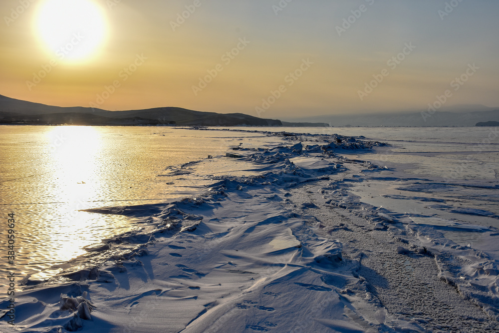 Sunset on frozen Lake Baikal Siberia Russia 