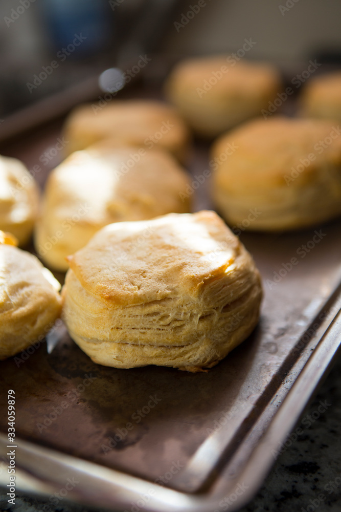 Freshly baked homemade buttermilk biscuits in natural light. A southern tradition