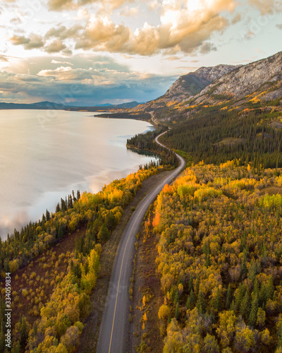 The remarkable, stunning, autumn, fall landscape of Yukon Territory in Northern Canada.  Drone, aerial woods, lake shot.