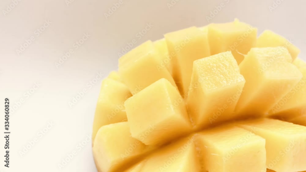 Yellow mango slice with cubes isolated white background Yellow mango slice with cubes isolated white background