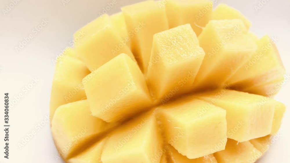 Yellow mango slice with cubes isolated white background Yellow mango slice with cubes isolated white background