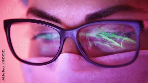 Wallpaper Mural Close up of doctor with face mask watching Coronavirus statistics on laptop monitor reflected on glasses Torontodigital.ca