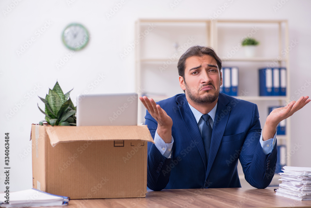 Young man being fired from his work Young man being fired from his work