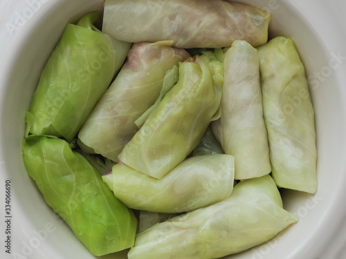 Savoy cabbage rolls stuffed with meat and vegetables, top view. photo