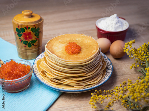 Pancakes with red caviar. Traditional Russian cuisine. Maslenitsa, shrovetide.