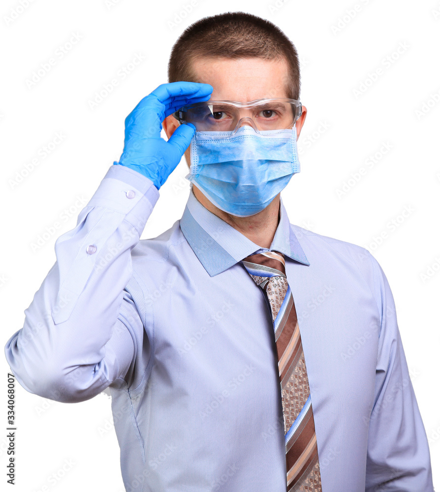 Male doctor wearing medical mask, rubber gloves, correcting glasses with hand