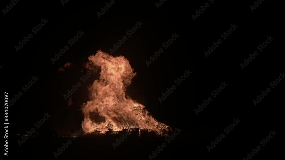Huge bonfire burning with large flames leaping up Huge bonfire burning with large flames leaping up
