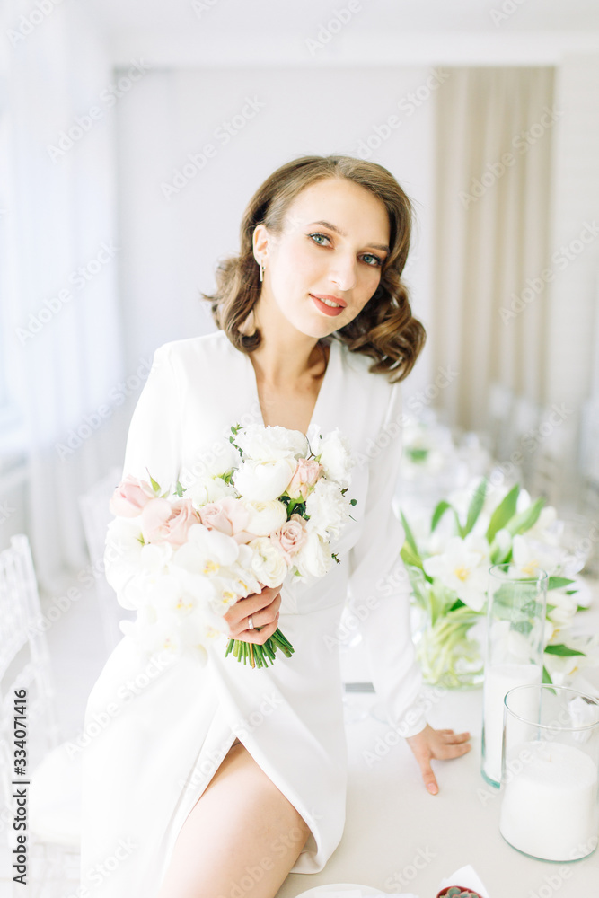 Stylish European wedding. Modern trends in the image of the bride. Bright portrait of the bride in the interior Studio. Stylish European wedding. Modern trends in the image of the bride. Bright portrait of the bride in the interior Studio.