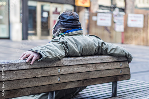 man sitting on a bench in the park