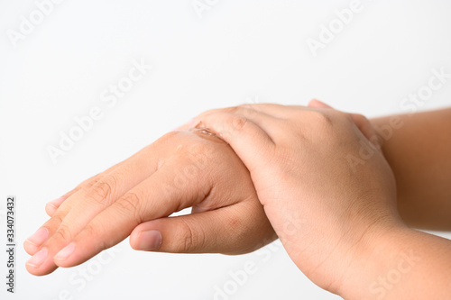 Hands Applying Sanitizer Gel. hands using wash hand sanitizer gel dispenser, against Novel coronavirus or Corona Virus Disease (Covid-19) at public train station. Antiseptic, Hygiene and Healthcare