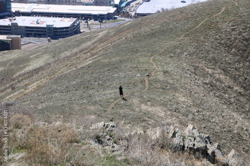 Hiker pauses to soak in the views on the Mt Van Cott hiking trail near Salt Lake City, Utah, USA photo