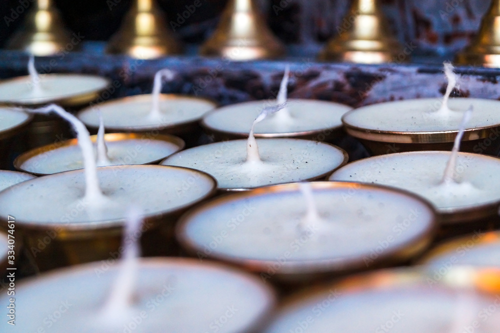 wax and Butter Lamps at Nako Monastery, Nako Himachal Pradesh India wax and Butter Lamps at Nako Monastery, Nako Himachal Pradesh India