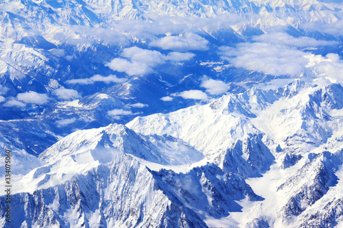 Aerial view from the aircraft to Caucasus Mountains covered with snow