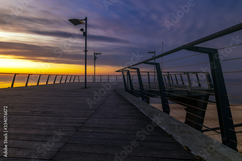 Wooden pier on the sea at dusk