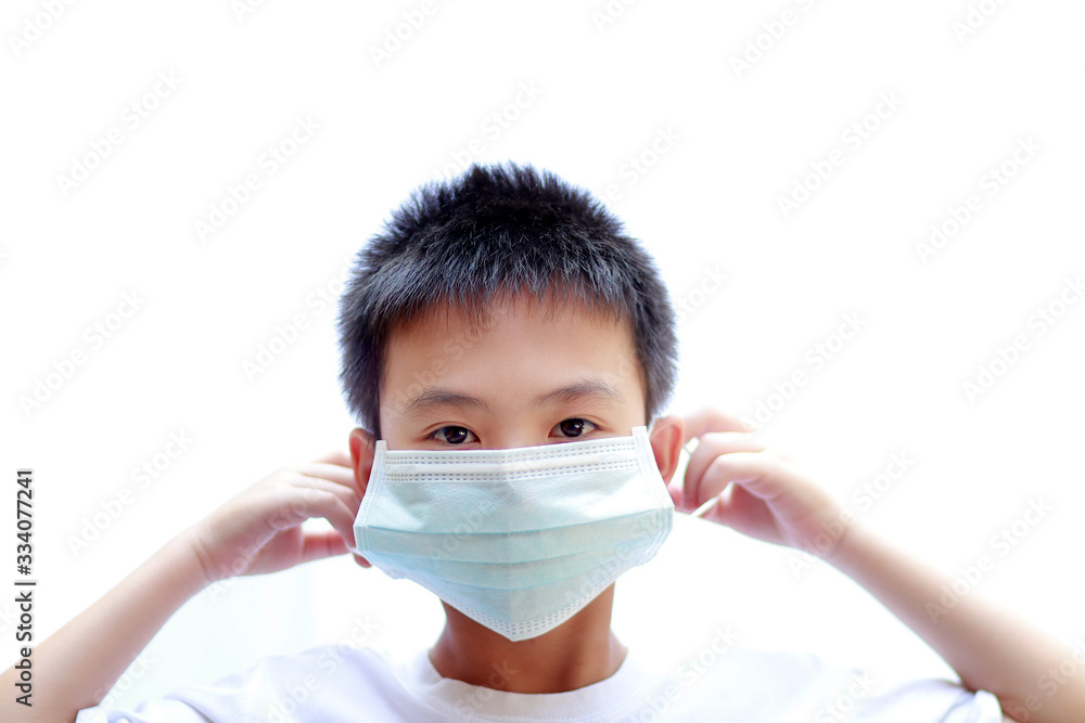 Asian boys with mask protection, COVID-19 or Virus protection concept Asian boys with mask protection, COVID-19 or Virus protection concept