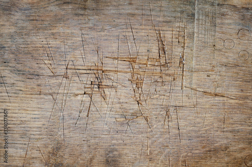 Photos old oak meat chopping board with scar marks, fragment, close-up, texture