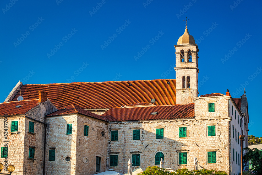 Historic buildings and the Franciscan monastery with the bell tower in Sibenik, Croatia, Europe.