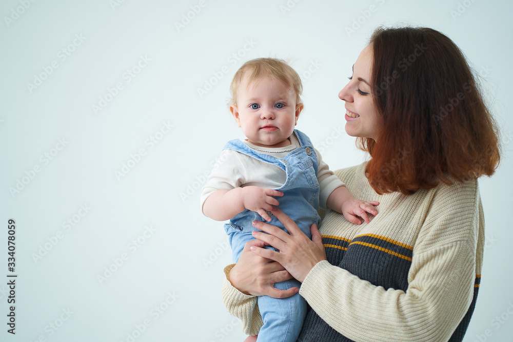 mom holds with her baby in her arms mom holds with her baby in her arms