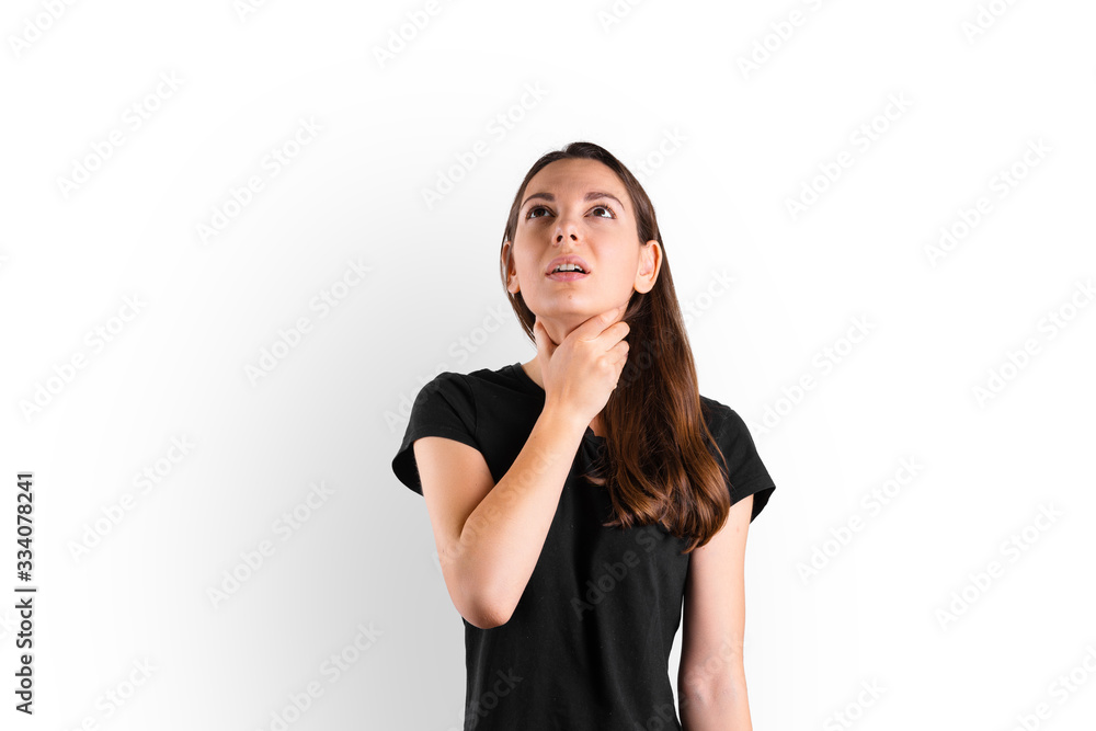 Young woman with throat sore stays at home. Influenza symptom. Seasonal flu. Covid-19 Young woman with throat sore stays at home. Influenza symptom. Seasonal flu. Covid-19