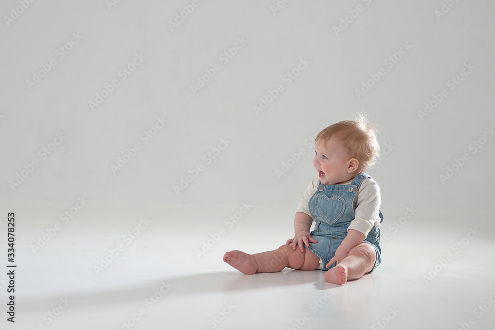 10 month old little baby learning to walk..Studio photography 10 month old little baby learning to walk..Studio photography
