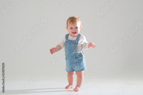 10 month old little baby learning to walk..Studio photography