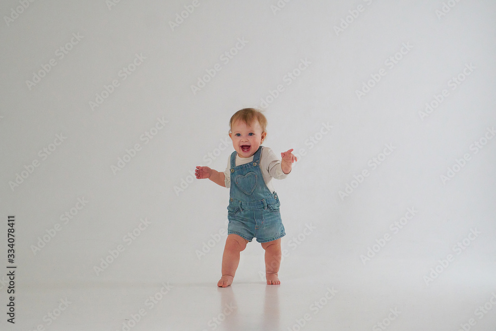 10 month old little baby learning to walk..Studio photography