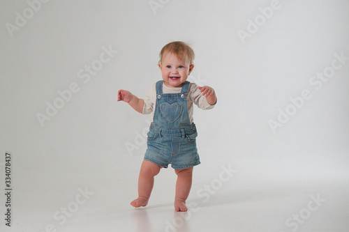 10 month old little baby learning to walk..Studio photography photo