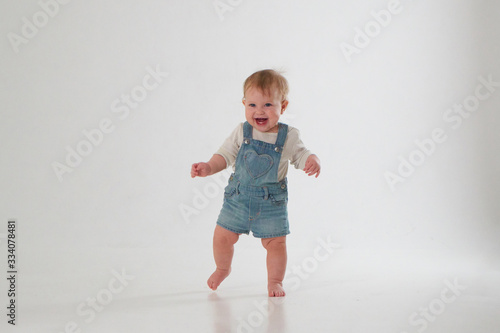 10 month old little baby learning to walk..Studio photography