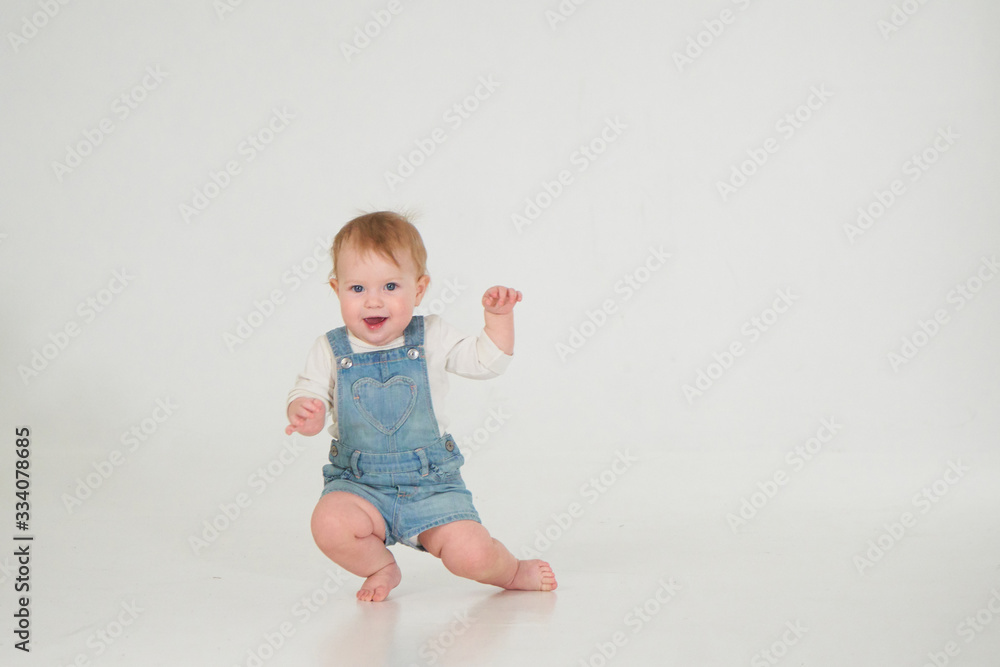 10 month old little baby learning to walk..Studio photography 10 month old little baby learning to walk..Studio photography