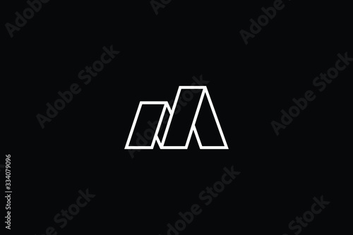 Minimal elegant monogram art logo. Outstanding professional trendy awesome artistic M MM MN NM initial based Alphabet icon logo. Premium Business logo White color on black background