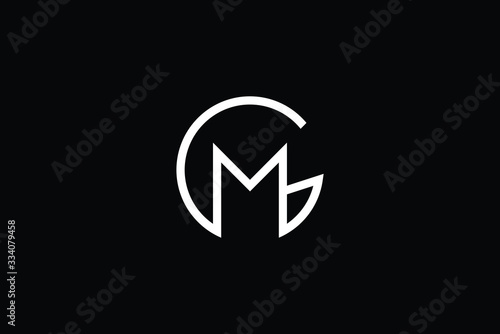 Minimal elegant monogram art logo. Outstanding professional trendy awesome artistic GM MG initial based Alphabet icon logo. Premium Business logo White color on black background