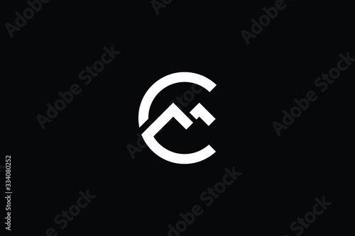 Minimal elegant monogram art logo. Outstanding professional trendy awesome artistic CM MC initial based Alphabet icon logo. Premium Business logo White color on black background photo