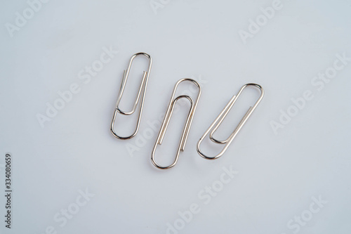 Paper clip on the white background  Red steel clip