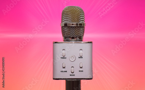 Wireless Bluetooth Karaoke Microphone isolated on a jazzy background