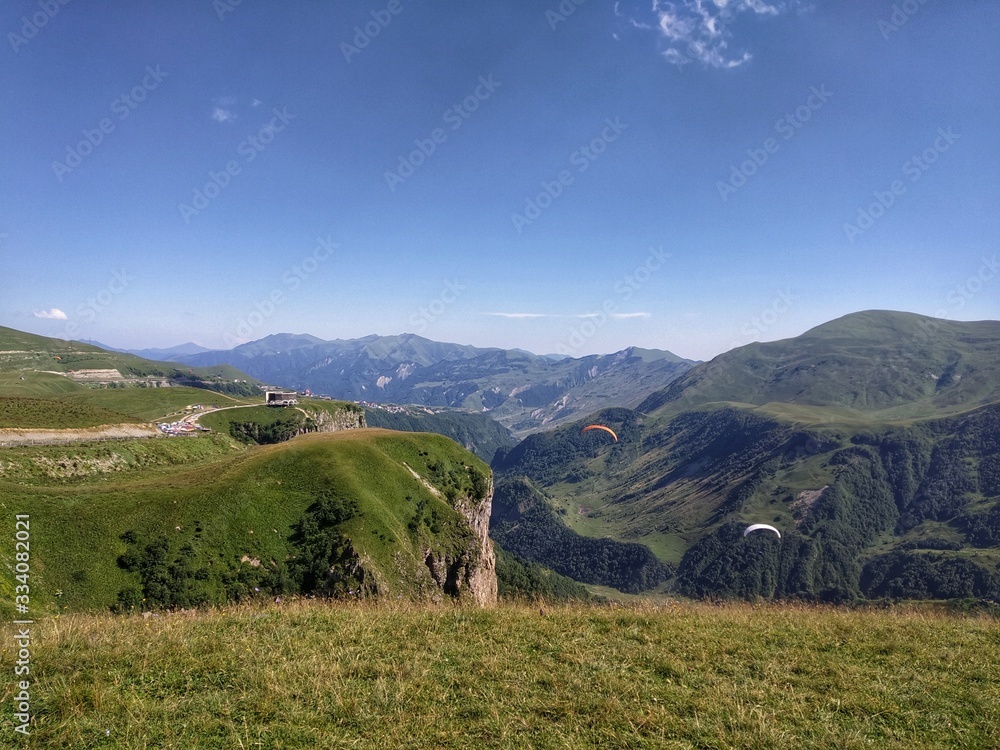 Naklejka premium Paragliding over the canyon