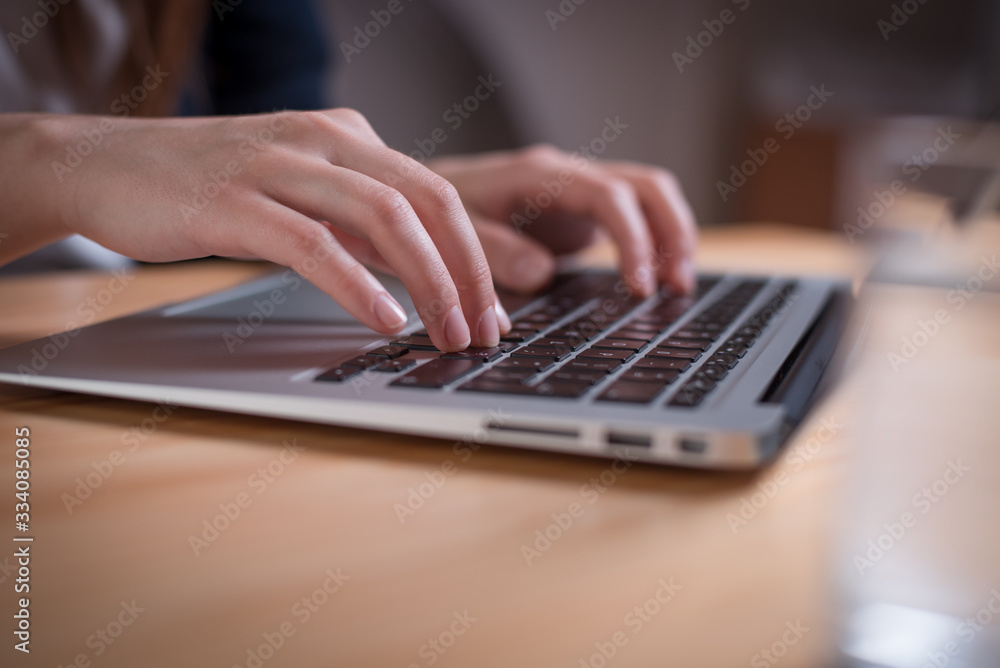 Close up of a woman hands typing on the laptop Close up of a woman hands typing on the laptop