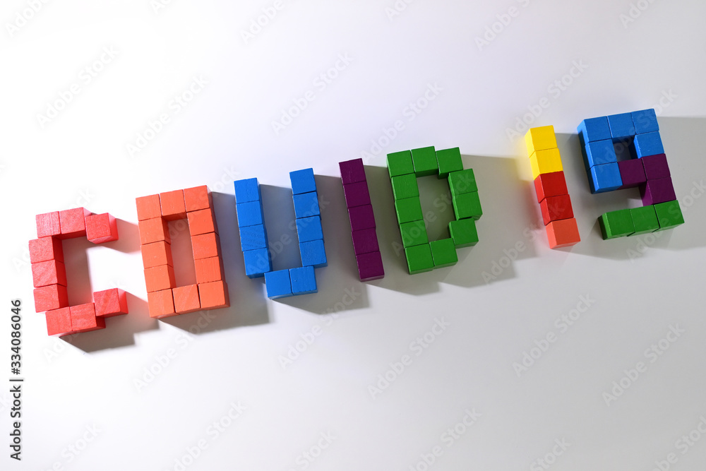 topic COVID-19 text message from wooden block toy of kid on white background topic COVID-19 text message from wooden block toy of kid on white background