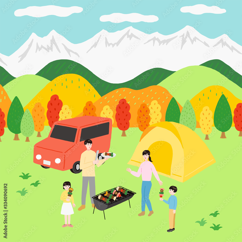 バーベキューを楽しむ家族　オートキャンプ　紅葉