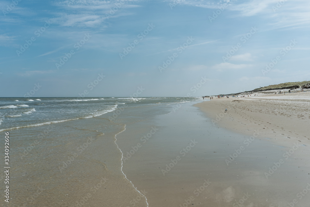 North Sea coast, view over the beach landscape on a sunny day, Wangerooge, Germany 