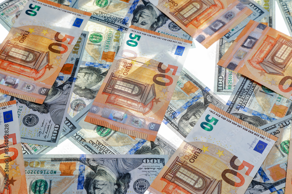 different dollar and euro bills on a white background different dollar and euro bills on a white background