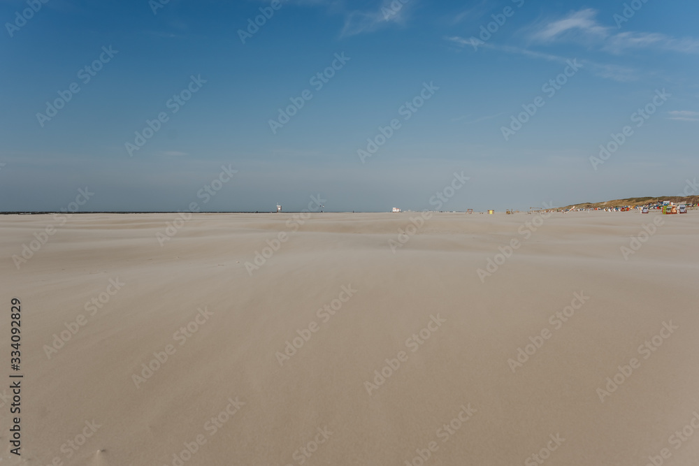 wide beach landscape on a sunny day with blue sky in summer wide beach landscape on a sunny day with blue sky in summer