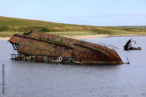 Orkney (Scotland), UK - August 06, 2018: World War II boat intentionally sunk to protect the natural harbour of Scapa Flow, Orkney, Scotland, Highlands, United Kingdom