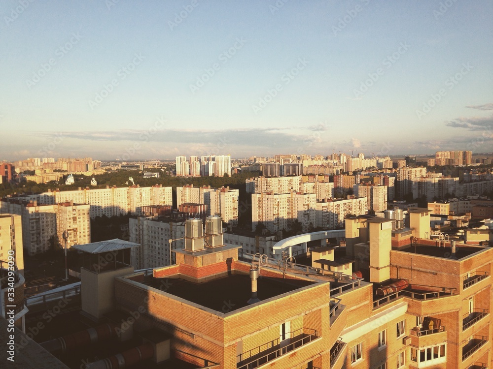 Obraz premium view from the roof of the city in the summer houses and trees