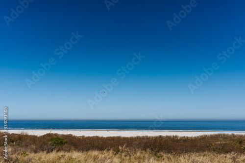 Wide sand beach landscape  sunny day  blue sky  Juist  Germany