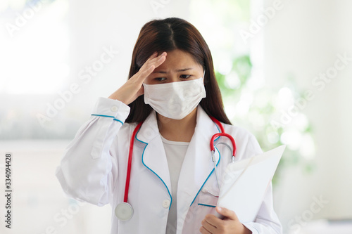 Doctor or nurse with stethoscope and face mask.